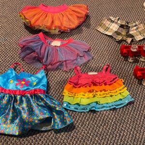 Build a bear dress-up fun. Shorts, 2 tutus, roller skates, dress, and top.
